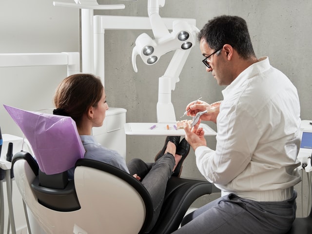 Dentist talking to a patient 