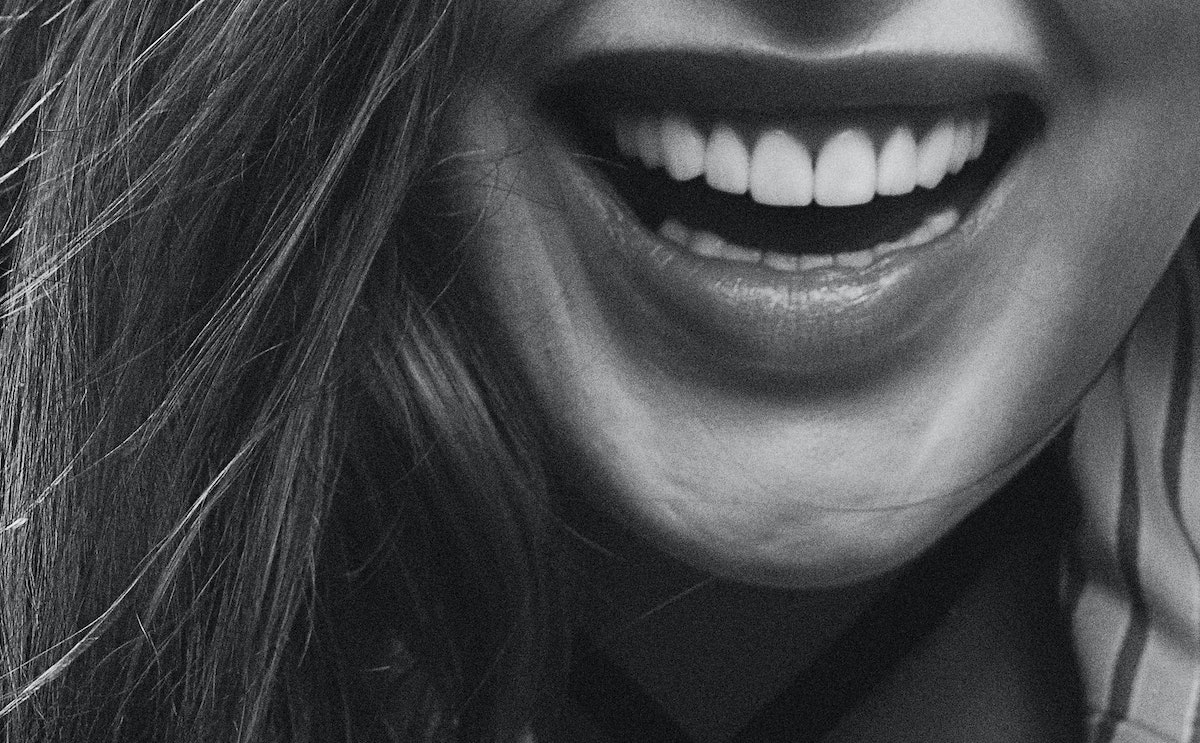 Woman Smiling Closeup of Teeth/Mouth in black and white